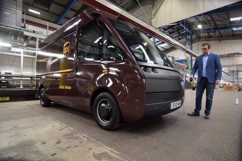 Luke Wake, UPS vice president of maintenance and engineering, demonstrates features on a test model of a fully-electric Arrival van, in London