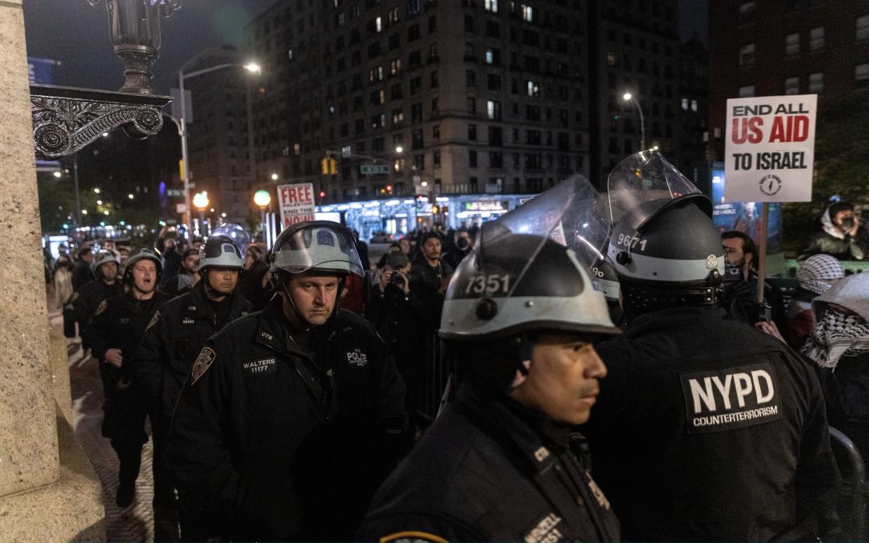 Police line the streets outside the campus