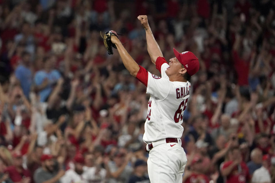 St. Louis Cardinals relief pitcher Giovanny Gallegos celebrates after defeating the Milwaukee Brewers in a baseball game to clinch a playoff spot Tuesday, Sept. 28, 2021, in St. Louis. (AP Photo/Jeff Roberson)