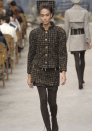 Chanel AW13 Couture: Joan Smalls led the runway in a metallic tweed outfit with bizarre headgear.