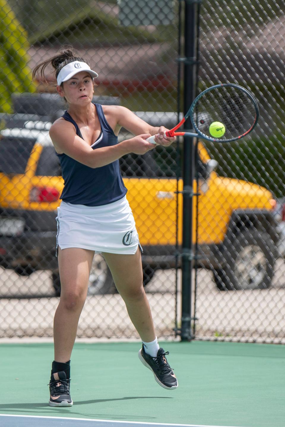 Pueblo Central’s Isabella Guzman hits a return off a serve in the final-day No. 3 singles match of the Class 3A Region 7 girls tennis tournament at the Pueblo City Park tennis courts on May 7, 2022.