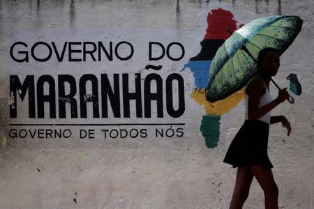 A woman leaves a polling station during municipal elections in Sao Luis, Brazil, October 2, 2016. REUTERS/Ueslei Marcelino