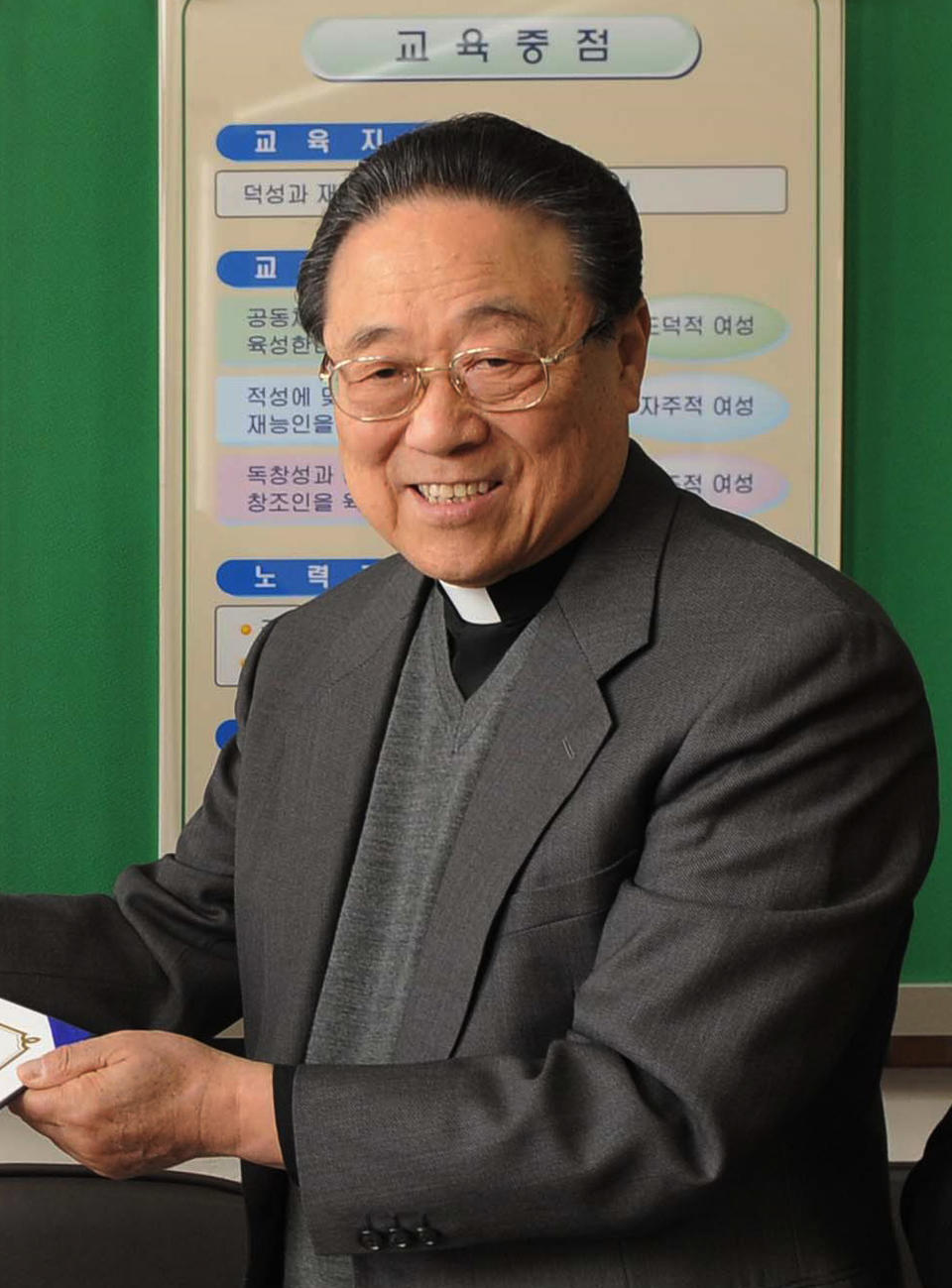 In this Feb. 10, 2009, photo, John Chang, a Roman Catholic bishop who visited North Korea in 1987, attends a charity event for disadvantaged students in Chuncheon, South Korea. Experts and defectors say most of North Korea’s underground Christians do not engage in the extremely dangerous work of proselytizing. Instead, they largely keep their beliefs to themselves or within their immediate families. (Yonhap via AP)