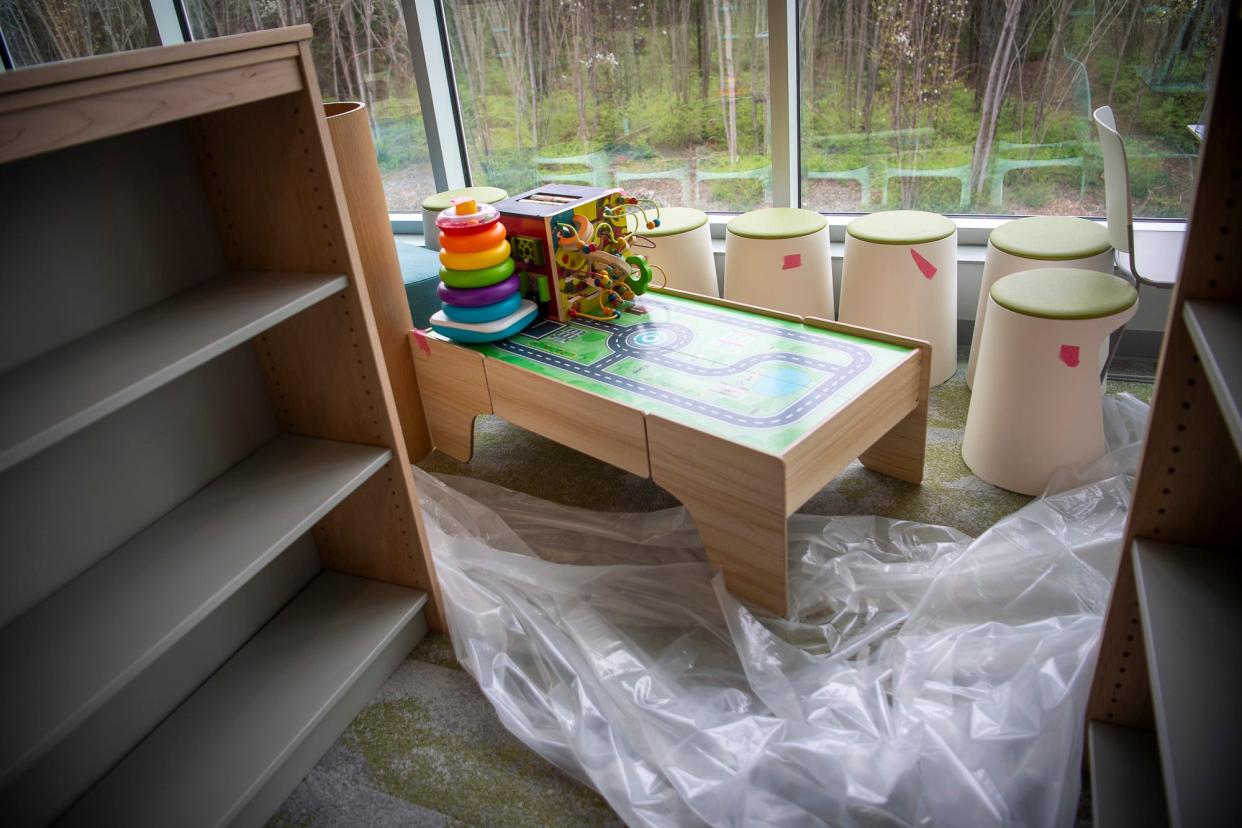 Empty shelves, toys, and stools in the children's area at the southwest branch of the Monroe County Public Library sit unused after a flood in January closed the building.