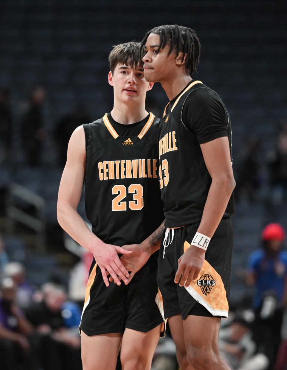 Centerville's Collin O'Connor (23) and Jonathan Powell (33) celebrate a victory over Pickerington Central during the Ohio Play-by-Play Classic on Dec. 17 at Nationwide Arena.