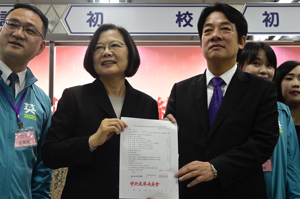 Taiwan's President Tsai Ing-wen (2nd L) and former premier William Lai (R) display a certificate after registering as presidential and vice presidential candidates for the upcoming election at the Central Elections Committee in Taipei on November 19, 2019. - Taiwan will elect a new president and parliament on January 11. (Photo by Sam Yeh / AFP) (Photo by SAM YEH/AFP via Getty Images)