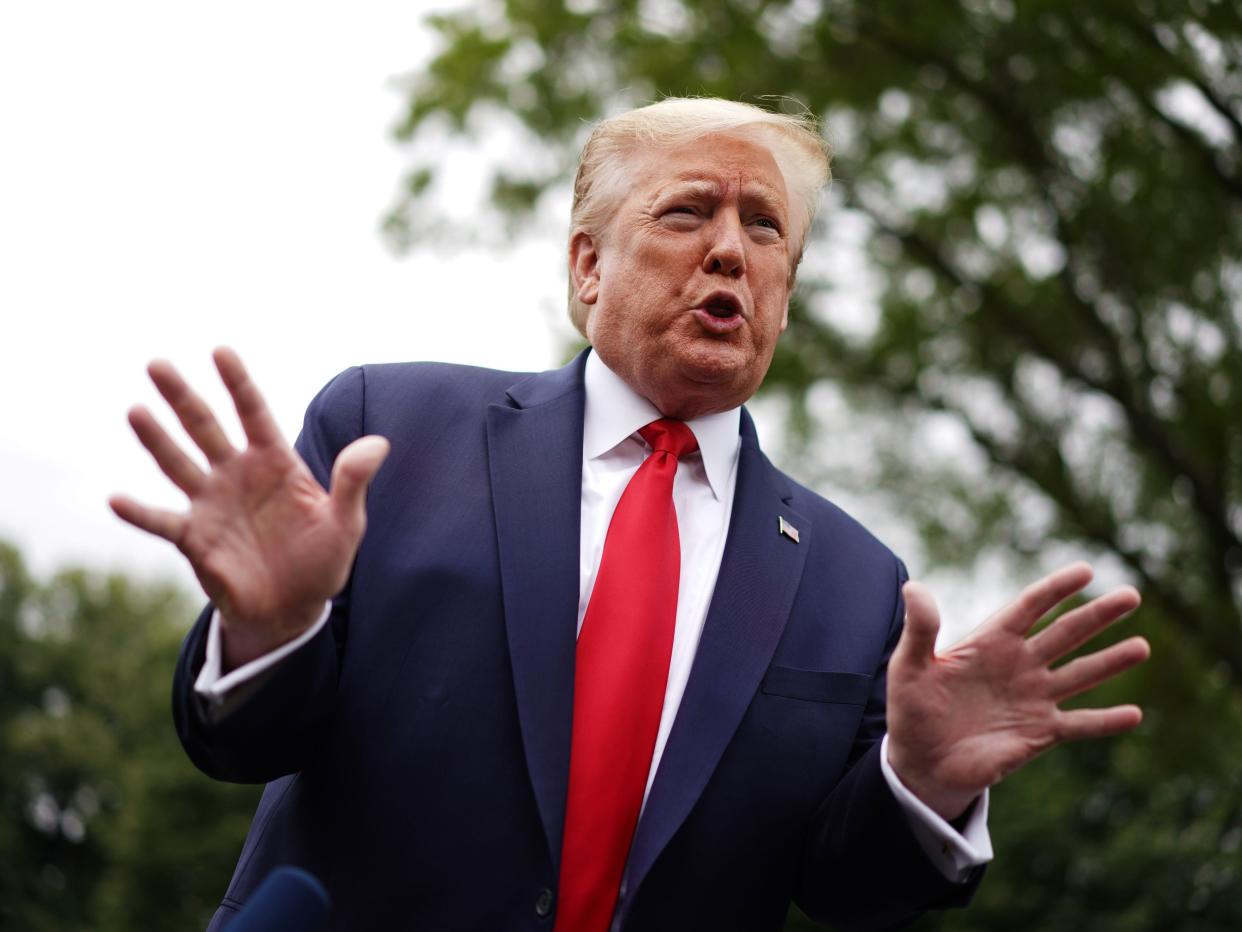 US President Donald Trump speaks to the press as he departs the White House in Washington, DC, on May 21, 2020. - Trump said Thursday that the United States is withdrawing from the Open Skies arms control treaty with Russia, accusing Moscow of breaking the terms. (Photo by MANDEL NGAN / AFP) (Photo by MANDEL NGAN/AFP via Getty Images)