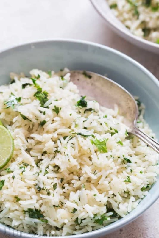 <p>Curry Trail</p><p>Cilantro lime rice is packed with fresh herbs and zesty flavors. Better than Chipotle’s, because it’s homemade and you get to adjust the flavors. </p><p><strong>Get the recipe: </strong><a href="https://www.currytrail.in/cilantro-lime-rice/?utm_medium=social&utm_source=pinterest&utm_campaign=tailwind_tribes&utm_content=tribes&utm_term=773981126_31832554_198426" rel="nofollow noopener" target="_blank" data-ylk="slk:Copycat Chipotle Cilantro Lime Rice;elm:context_link;itc:0;sec:content-canvas" class="link ">Copycat Chipotle Cilantro Lime Rice</a></p>