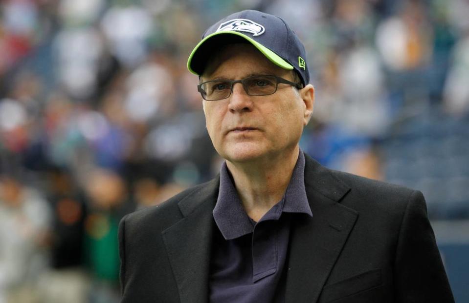 FILE - In this Oct. 14, 2012 file photo, Seattle Seahawks owner Paul Allen appears on the field prior to an NFL football game against the New England Patriots in Seattle. (AP Photo/Elaine Thompson, File)