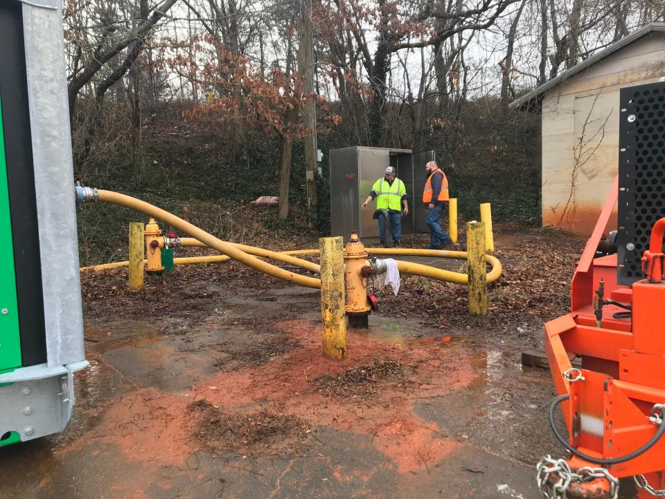 City of Asheville water resources crews work to address city water outages in Roger Farmer Memorial Park at 71 Deaverview Road on Dec. 30, 2022.