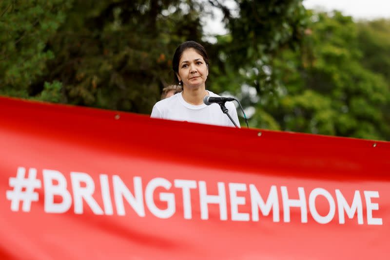 Vina Nadjibulla, wife of Michael Kovrig, with supporters of Michael Kovrig and Michael Spavor march in Ottawa