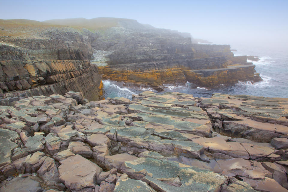 These rugged sea cliffs are named after the <a href="http://www.env.gov.nl.ca/env/parks/wer/r_mpe/" target="_blank">frequent fog that blankets the rocky coast</a>, blinding sailors from the hazards near the shore. This shoreline also contains some of the <a href="http://whc.unesco.org/en/list/1497" target="_blank">oldest known assemblages of large fossils in the world</a>, with some&nbsp;dating back to 560 million years ago.