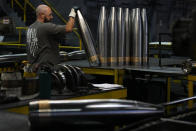 A steel worker manufactures 155 mm M795 artillery projectiles at the Scranton Army Ammunition Plant, Tuesday, Aug. 27, 2024, in Scranton, Pa. (AP Photo/Matt Slocum)