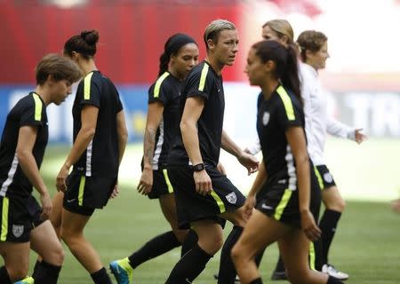 Jul 4, 2015; Vancouver, BC, CAN; United States forward Abby Wambach (center) warms up with her teammates during a training session for the 2015 Women's World Cup at B.C. Place. Michael Chow-USA TODAY Sports