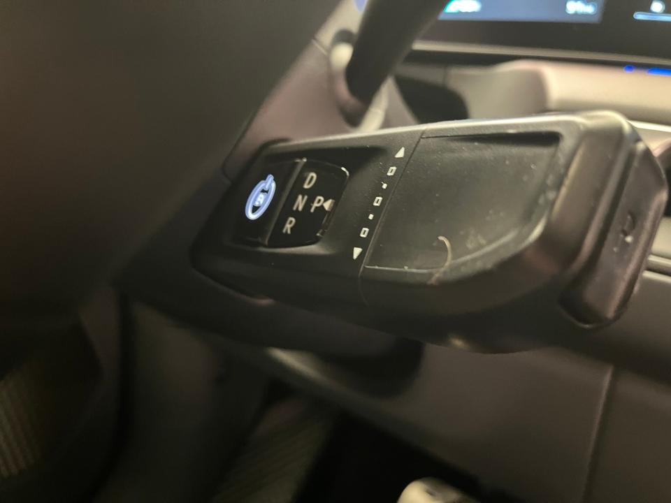 The 2024 Kia EV9 electric midsize SUV's start button and gear selector are attached to the steering column.