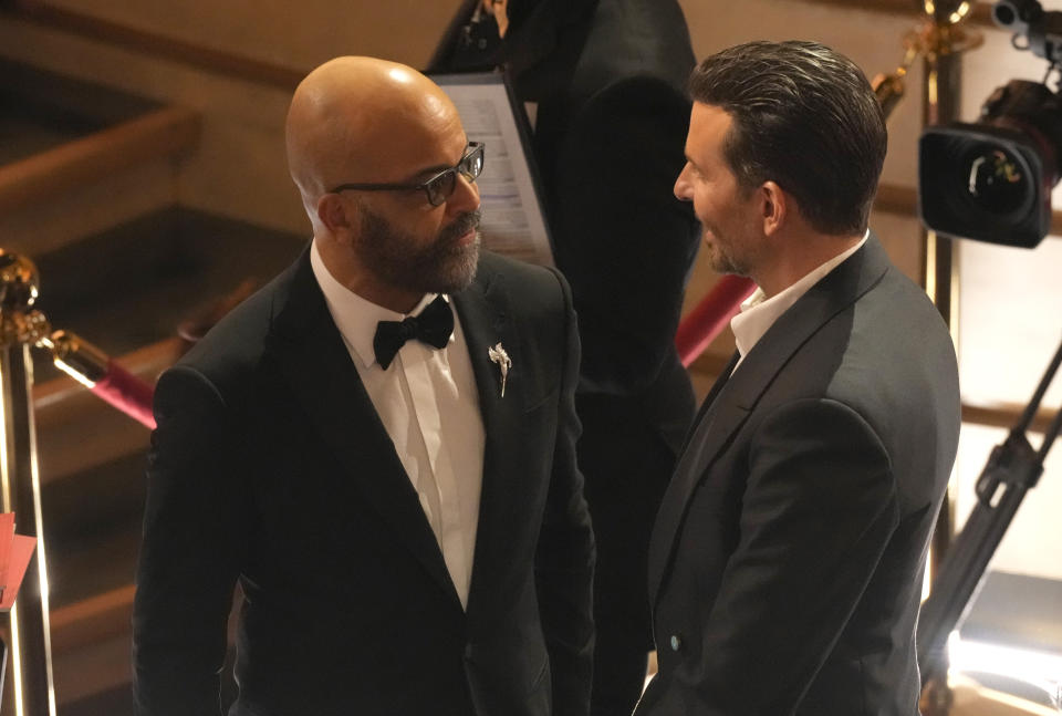 Jeffrey Wright, left, and Bradley Cooper appear in the audience during the Oscars on Sunday, March 10, 2024, at the Dolby Theatre in Los Angeles. (AP Photo/Chris Pizzello)