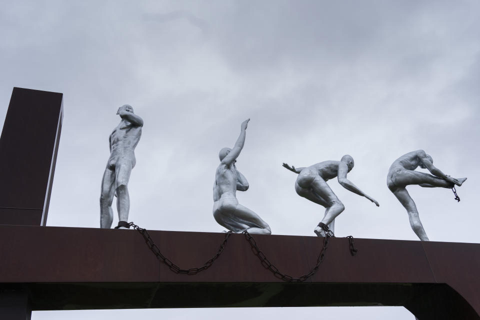 Clave, Monument for Slavery, by Alex da Silva, is seen in Rotterdam, Netherlands, Monday, Dec. 19, 2022. The Dutch government is expected to issue a long-awaited formal apology for its role in the slave trade, with a speech by Dutch Prime Minister Mark Rutte, and ceremonies in the former colonies. (AP Photo/Peter Dejong)