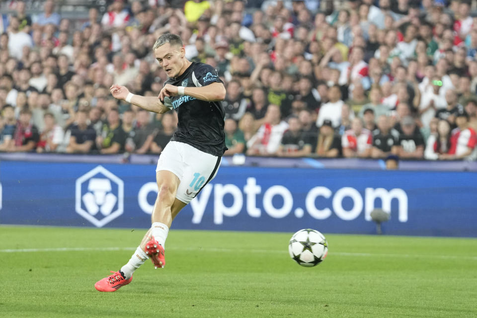 Leverkusen's Florian Wirtz scores during the Champions League opening phase soccer match between Feyenoord and Leverkusen in Rotterdam, Netherlands, Thursday, Sept. 19, 2024. (AP Photo/Peter Dejong)