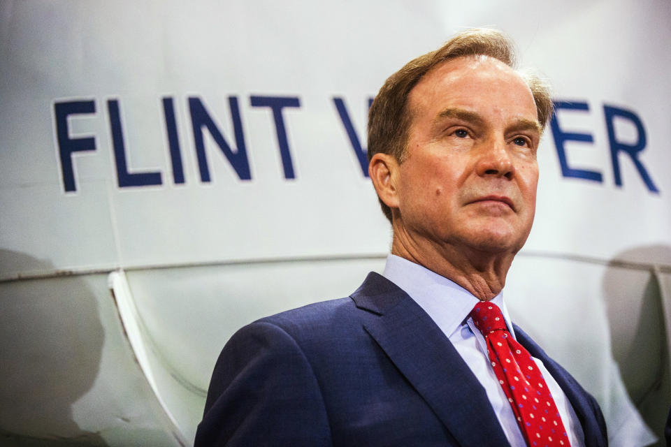 FILE - In this June 14, 2017 file photo, Michigan Attorney General Bill Schuette fields questions from reporters in Flint, Mich., after announcing charges against five water officials with manslaughter related to their alleged failure to act during the Flint water crisis. In 2016, Schuette promised to investigate the Flint water scandal “without fear or favor” and pledged that state regulators would be locked up for fudging data and misleading the public about lead in the poor city’s pipes. Yet three years later, no one is behind bars. (Jake May/The Flint Journal-MLive.com via AP, File)