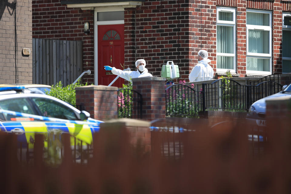 Forensics officers at a property on Gregg House Road in Shiregreen, Sheffield, on Friday (Picture: PA)