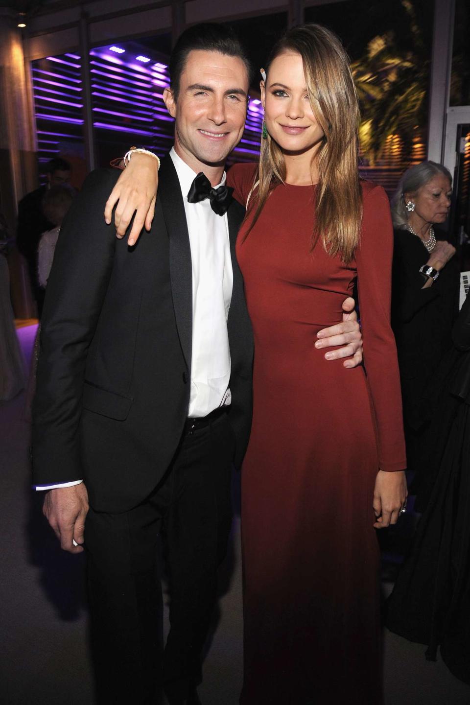 Behati Prinsloo and Adam Levine attend the 2014 Vanity Fair Oscar Party Hosted By Graydon Carter on March 2, 2014 in West Hollywood, California