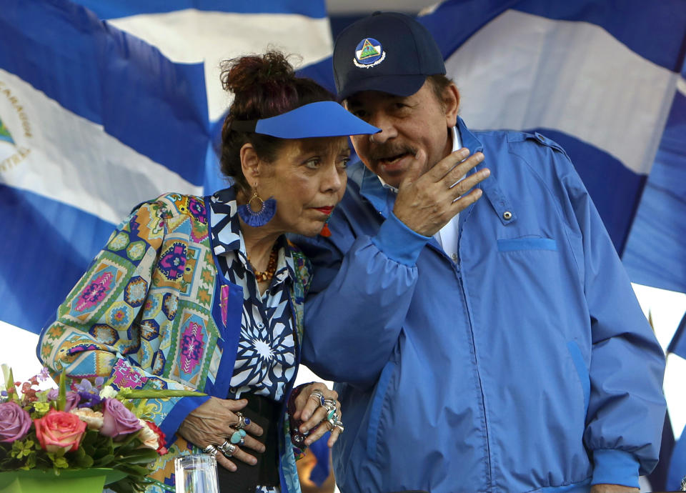 FILE - Nicaragua's President Daniel Ortega and his wife, Vice President Rosario Murillo, lead a rally in Managua, Nicaragua, Sept. 6, 2018. The U.S. State Department called Nicaragua’s formal withdrawal from the Organization of American States on Sunday, Nov. 19, “another step away from democracy.” The regional body, known by its initials OAS, has long criticized rights violations under Nicaraguan President Daniel Ortega. Ortega, who governs alongside his wife, Vice President Rosario Murillo, has rejected those criticisms and started the two-year process to leave the OAS in November 2021. (AP Photo/Alfredo Zuniga, File)