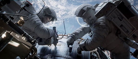 — Sandra Bullock and George Clooney are astronauts in "Gravity," director Alfonso Cuarón's new film coming Oct. 4.