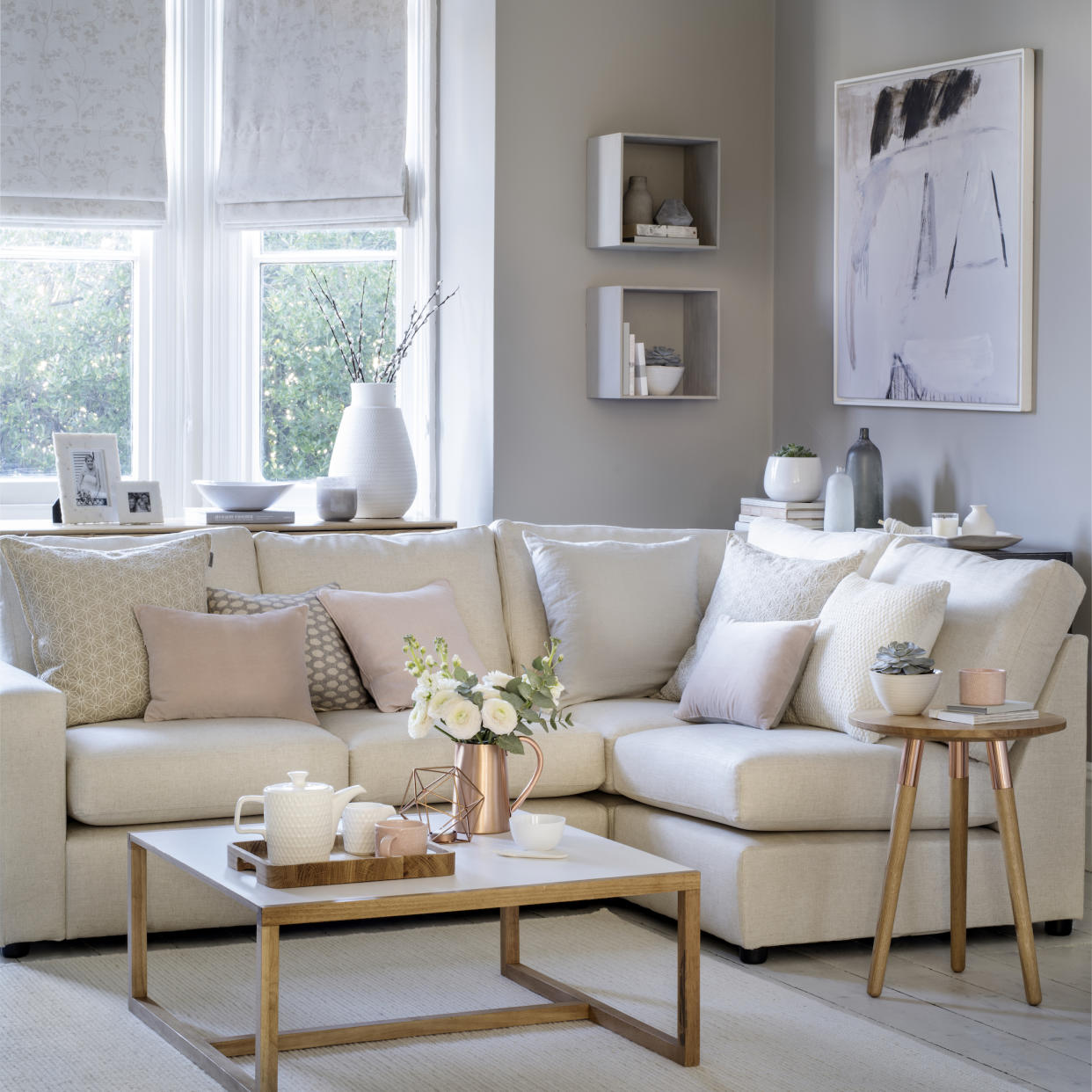  Corner sofa in neutral pastel living room. 