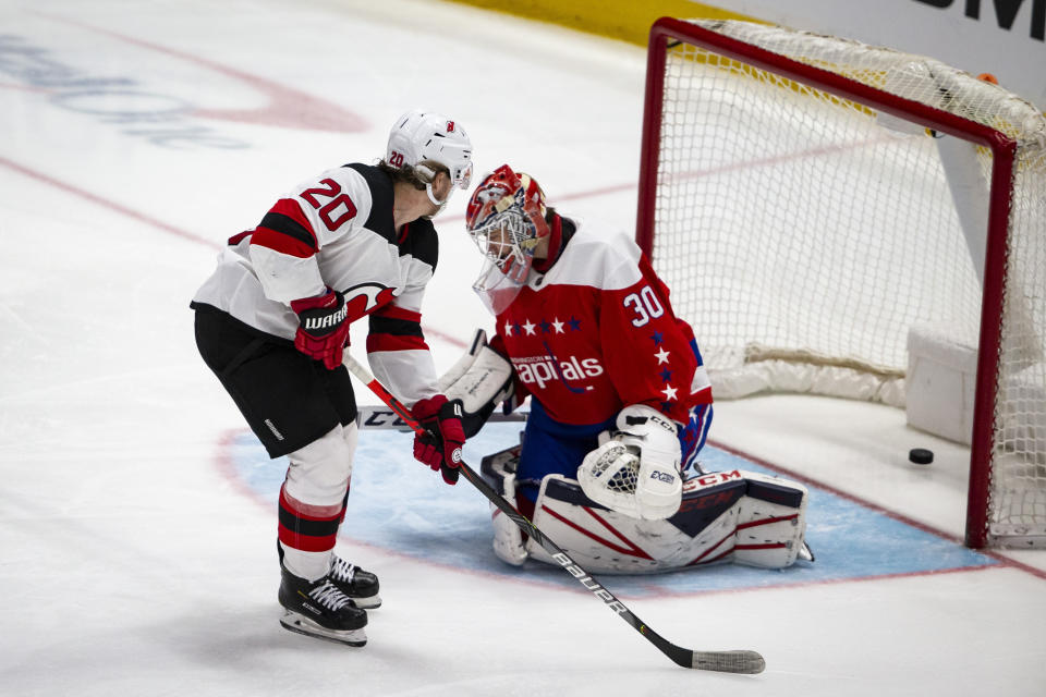 New Jersey Devils center Blake Coleman (20) scores past Washington Capitals goaltender Ilya Samsonov (30), from Russia, during the third period of an NHL hockey game, Thursday, Jan. 16, 2020, in Washington. The Capitals won 5-2. (AP Photo/Al Drago)