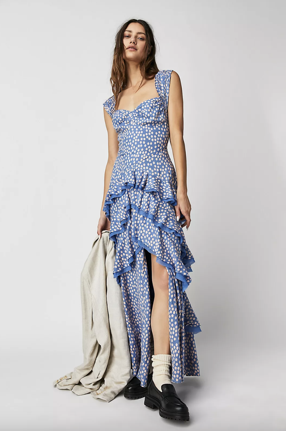 brunette model wearing white and blue polka dot Moon River Maxi Dress (photo via Free People)