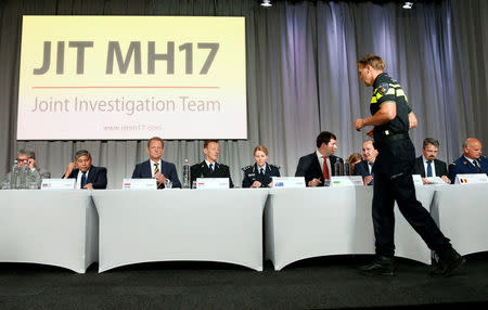 Members of the Joint Investigation Team, comprising the authorities from Australia, Belgium, Malaysia, the Netherlands and Ukraine, present interim results in the ongoing investigation of the 2014 MH17 crash that killed 298 people over eastern Ukraine, during a news conference in Bunnik, Netherlands, May 24, 2018. REUTERS/Francois Lenoir
