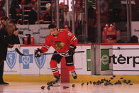 Chicago Blackhawks' Frank Nazar skates onto the ice before before a NHL hockey game against the Carolina Hurricanes, Sunday, April 14, 2024, in Chicago. (AP Photo/Paul Beaty)