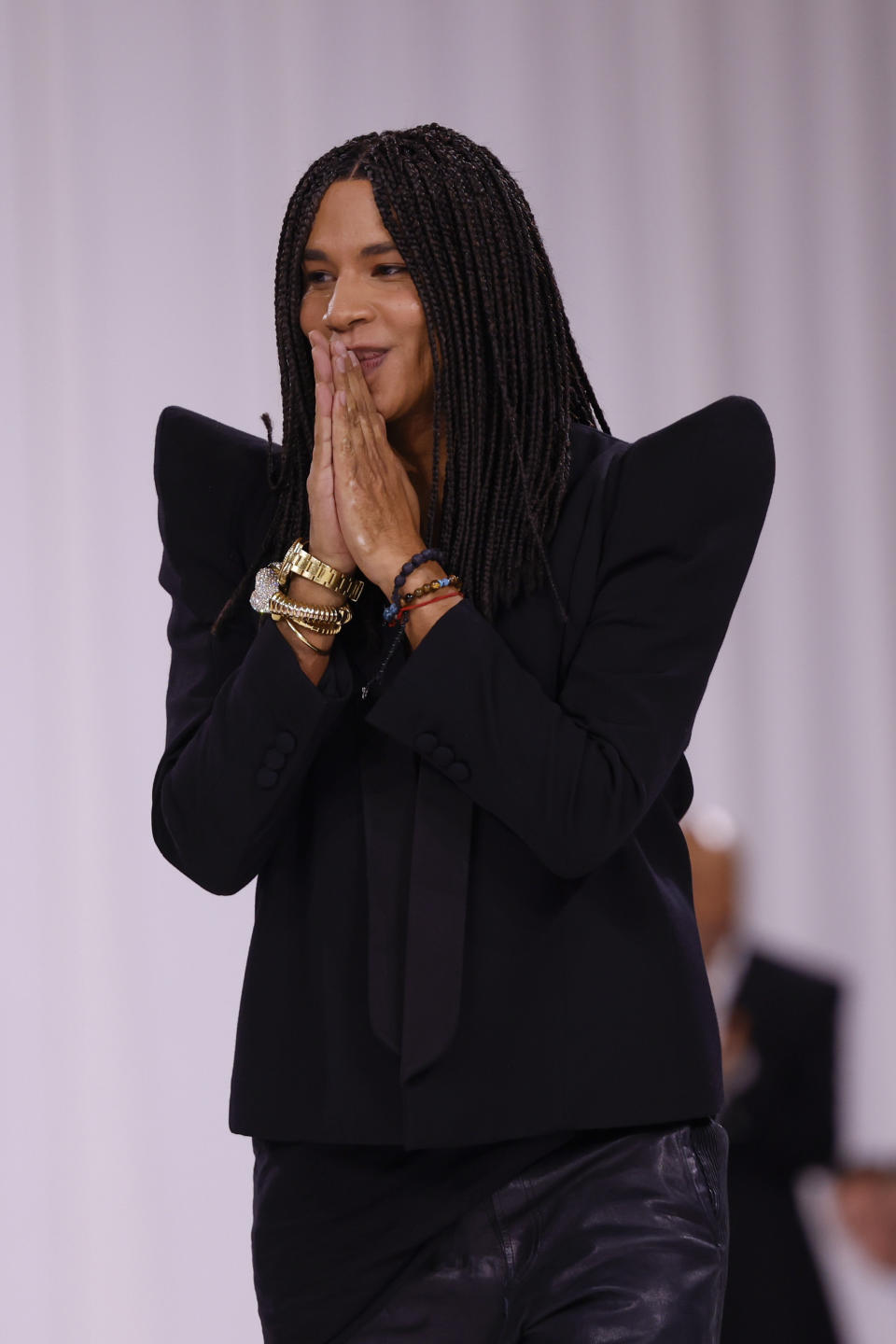 Designer Olivier Rousteing accepts applause after the Balmain Spring/Summer 2025 collection presented Wednesday, Sept. 25, 2024, in Paris. (Photo by Vianney Le Caer/Invision/AP)