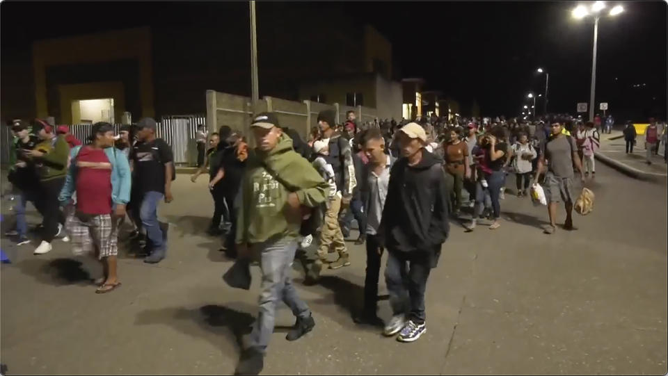 In this image from a video, a migrants caravan leaves San Pedro Sula, Honduras early Saturday, Jan. 20, 2024. A caravan of some 500 migrants that departed northern Honduras in hopes of reaching the United States dissolved Sunday after crossing the border into Guatemala, the Guatemalan Migration Institute reported. (AP Photo)