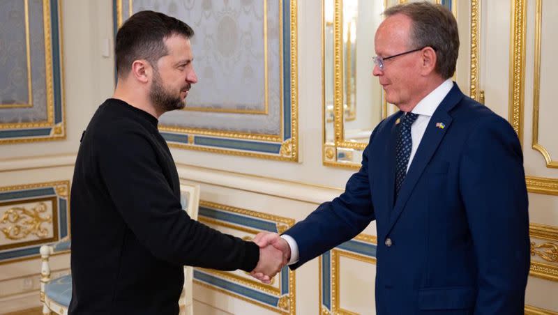 Ukraine President Voldymyr Zelenskyy shakes hands with Utah Senate President Stuart Adams in Kyiv, Saturday, May 6, 2023.