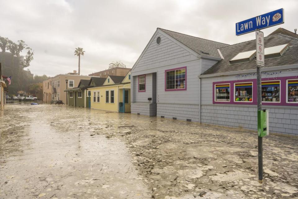 The streets are flooded in Capitola on Dec. 28 as powerful surf is rolling onto beaches on the West Coast