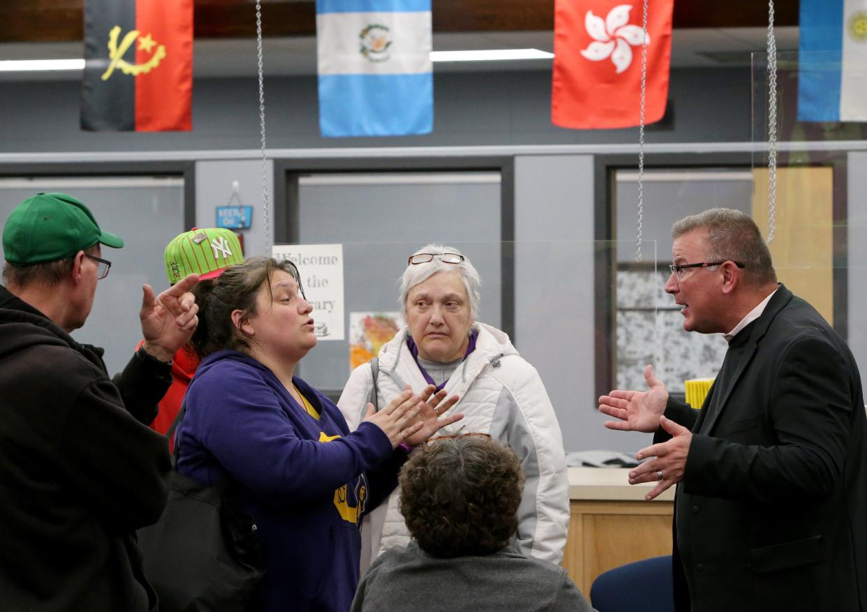 Tracy Richter, far right, of Fanning Howey, the firm for the South Bend school district’s long-range facilities master plan, discuses issues Wednesday, Feb. 8, 2023, with Clay High School parent Jennifer Fox, far left, and Becky Wagner at Clay International Academy in South Bend.