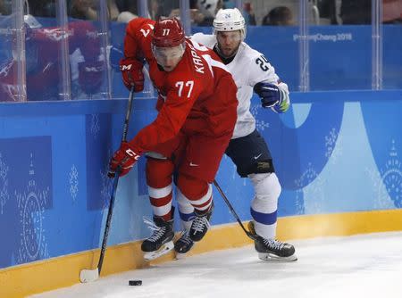 Ice Hockey – Pyeongchang 2018 Winter Olympics – Men Preliminary Round Match – Olympic Athletes from Russia v Slovenia - Gangneung Hockey Centre, Gangneung, South Korea – February 16, 2018 - Kirill Kaprizov, an Olympic Athlete from Russia, and Rok Ticar of Slovenia compete. REUTERS/Kim Kyung-Hoon