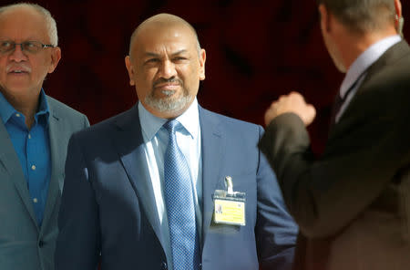 Yemen foreign minister Khaled al-Yamani walks in a hotel lobby in Geneva, Switzerland September 7, 2018. Picture taken through a window. REUTERS/Denis Balibouse