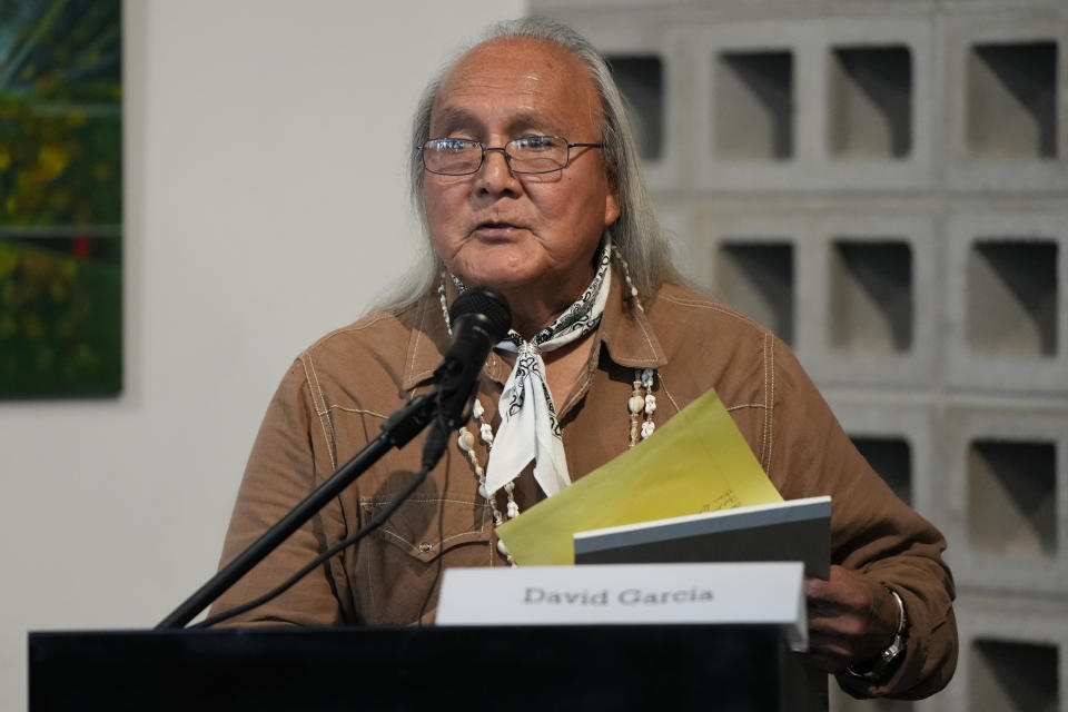 David Garcia speaks during a news conference by Native American advocacy groups, Thursday, Feb. 9, 2023, in Phoenix. The groups are calling for the NFL football team Kansas City Chiefs to drop their name, logo and their trademark “war chant” where fans make a chopping-hand gesture mimicking the Native American tomahawk. They play to demonstrate outside State Farm Stadium in the Phoenix suburb of Glendale during the Super Bowl 57 NFL football game. (AP Photo/Rick Scuteri)