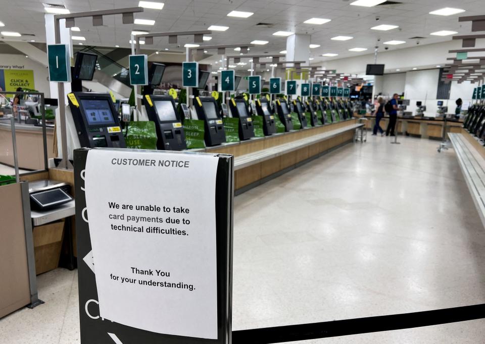 A notice informing customers they cannot pay by card is displayed in the self-checkout area of a Waitrose supermarket, amid a global IT outage, in Canary Wharf, London, Britain, July 19, 2024.
