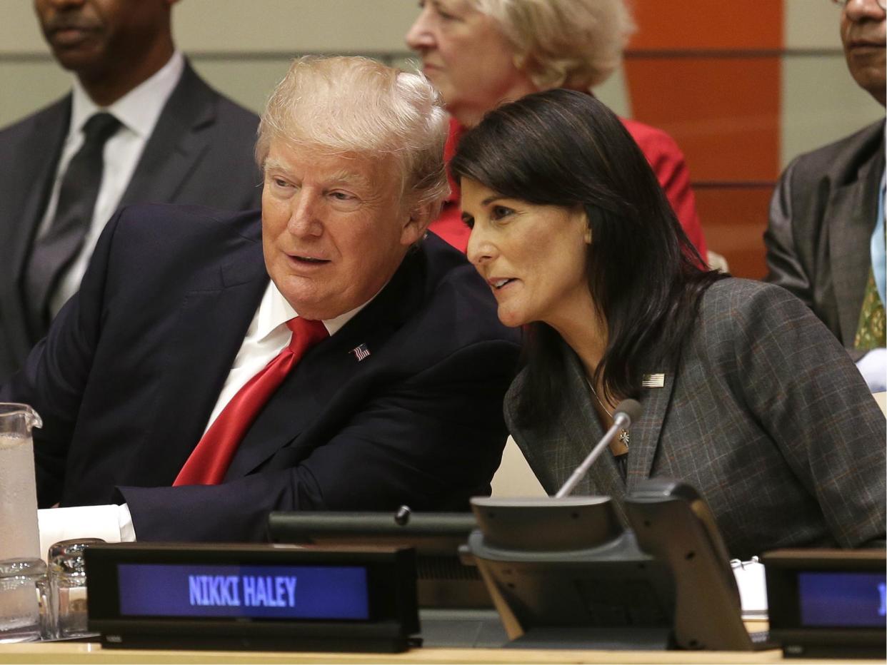 Donald Trump speaks with US Ambassador to the United Nations Nikki Haley before a meeting during the United Nations General Assembly in New York on 18 September 2017: AP