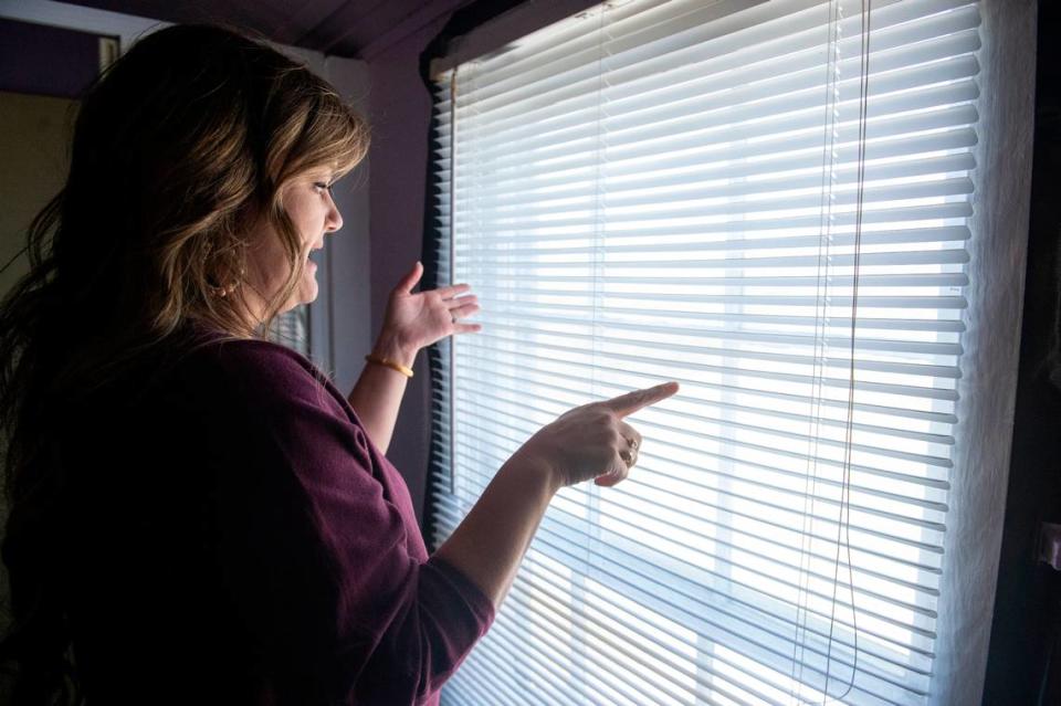 Michelle Hodges describes an addition she plans as she looks out a second floor window of the Seven Gables house in Ocean Springs on Thursday, March 28, 2024. Hodges wants to make the historic home livable for a modern family but says the one-story addition to the rear will keep the emphasis on the original architecture.