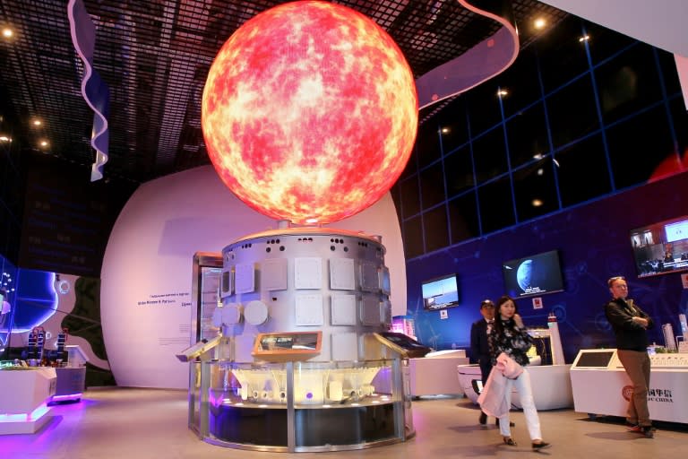 Visitors take in one of the pavilions at the expo