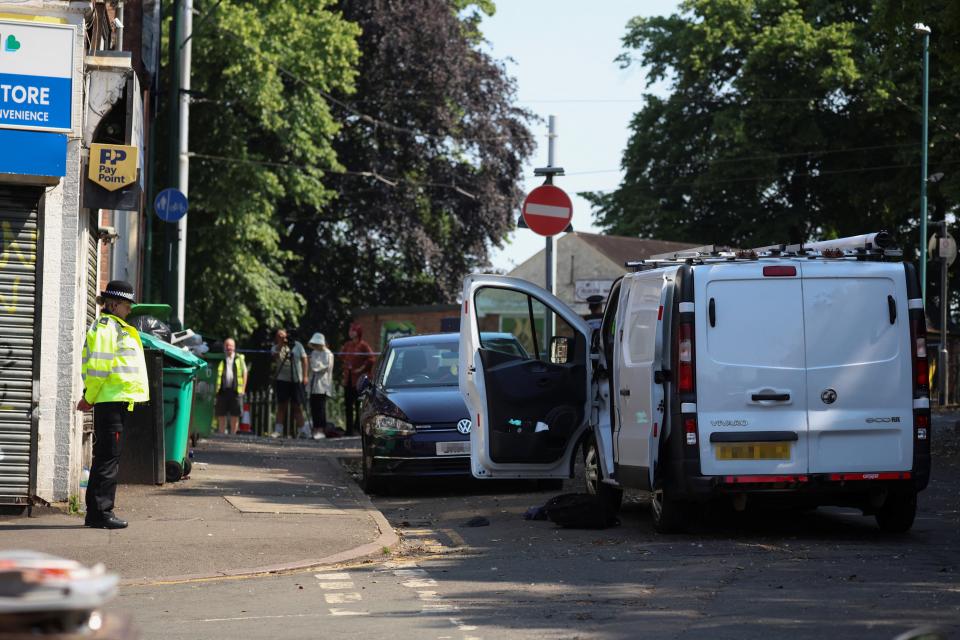 A police officer stands near a van in a cordon on the Bentinck Road following a major incident in Nottingham city centre, Nottingham (Reuters)