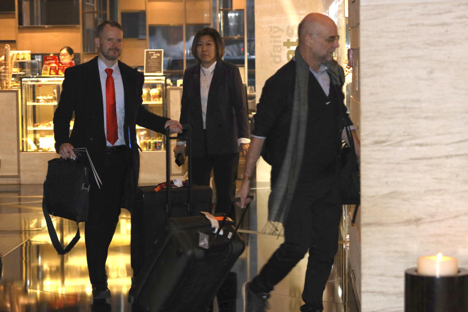 Members of a U.S. trade delegation arrive at a hotel in Beijing, China, Sunday, Jan. 6, 2019. A U.S. delegation led by deputy U.S. trade representative, Jeffrey D. Gerrish arrived in the Chinese capital ahead of trade talks with China,(AP Photo/Ng Han Guan)