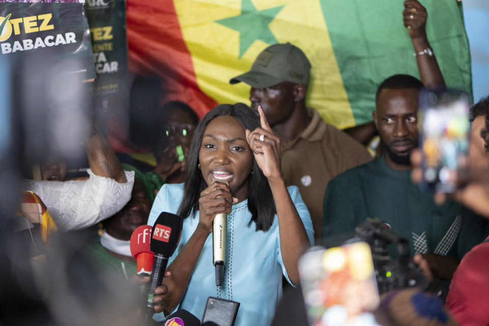 Presidential candidate Anta Babacar Ngom greets supporters during her electoral campaign caravan in Dakar, Senegal, Monday, March 11, 2024. Senegal’s only female presidential candidate may stand no chance of winning but activists say her presence alone is helping to advance a decades long campaign to achieve equality in the West African nation. (AP Photo/Sylvain Cherkaoui)