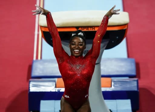 Simone Biles claimed a record-equalling 23rd world championship medal on Saturday