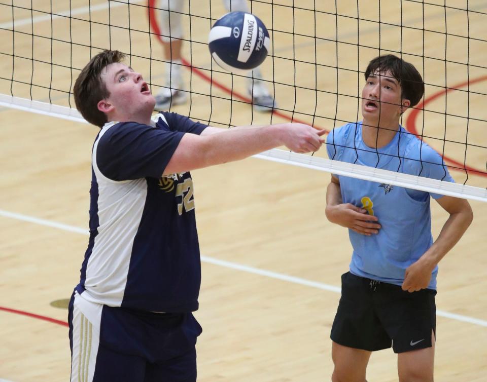 Salesianum's Ronan Landis (left) digs in front of Cape Henlopen's Charles Casas in Cape Henlopen's 3-0 win for the first DIAA state title earned in boys volleyball, Tuesday, May 23, 2023 at Smyrna High School.