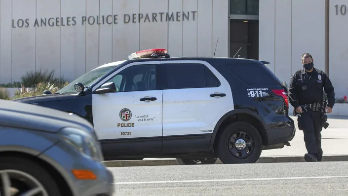 This file photo shows a member of the LAPD leaving headquarters on 1st St. in downtown Los Angeles. <span class="copyright">Mel Melcon / Los Angeles Times via Getty Images</span>